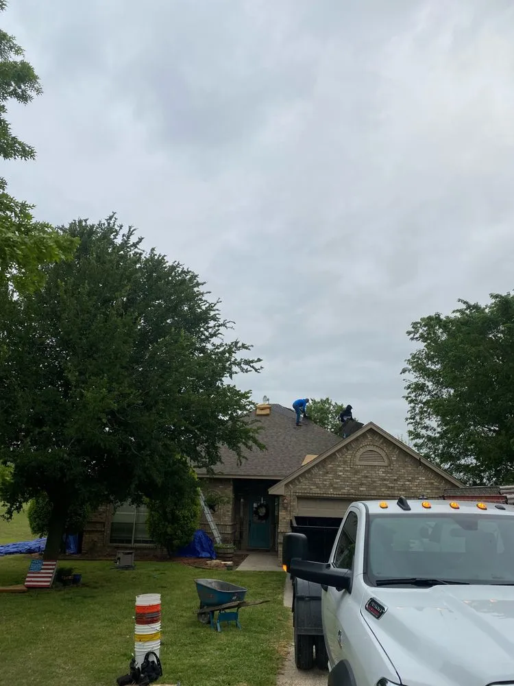 Slide of Mann & Sons Roofing