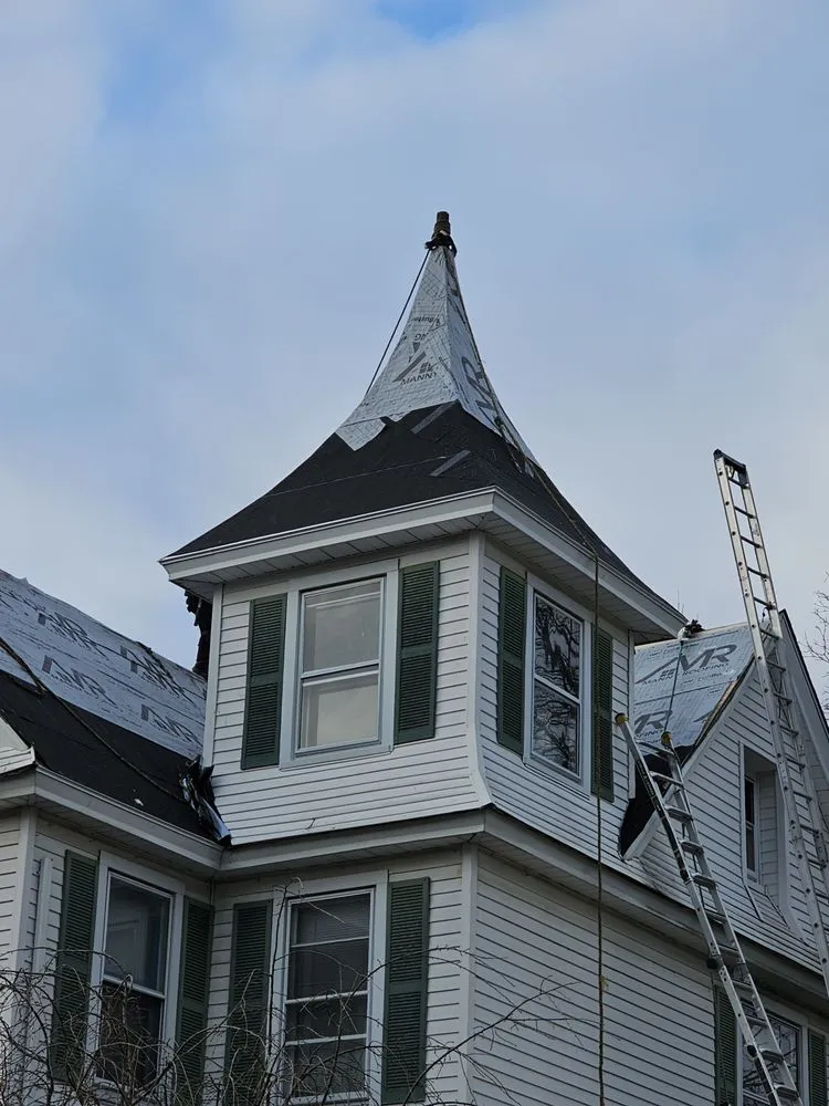 Slide of Manny Roofing