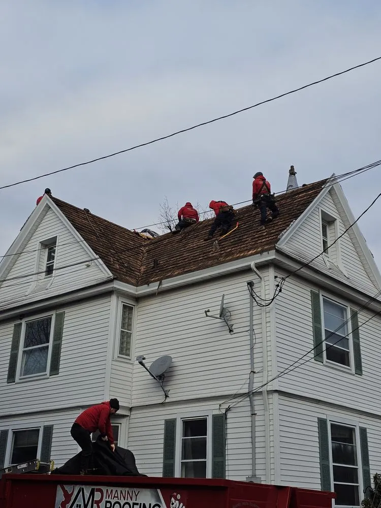 Slide of Manny Roofing