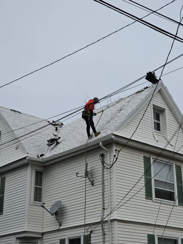 Slide of Manny Roofing