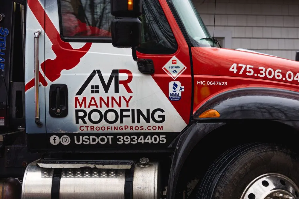 Slide of Manny Roofing