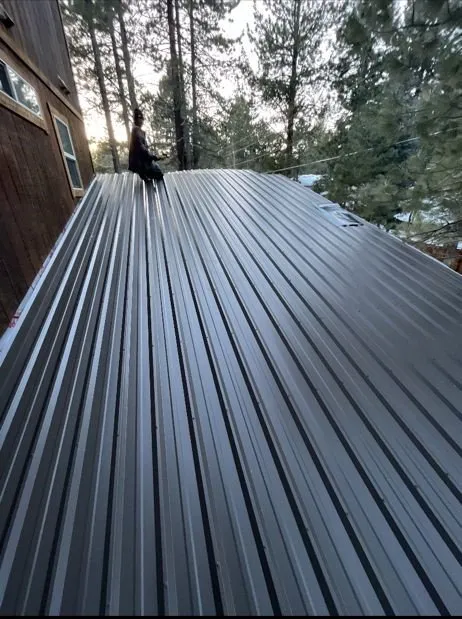 Slide of Manny's Metal Roofing