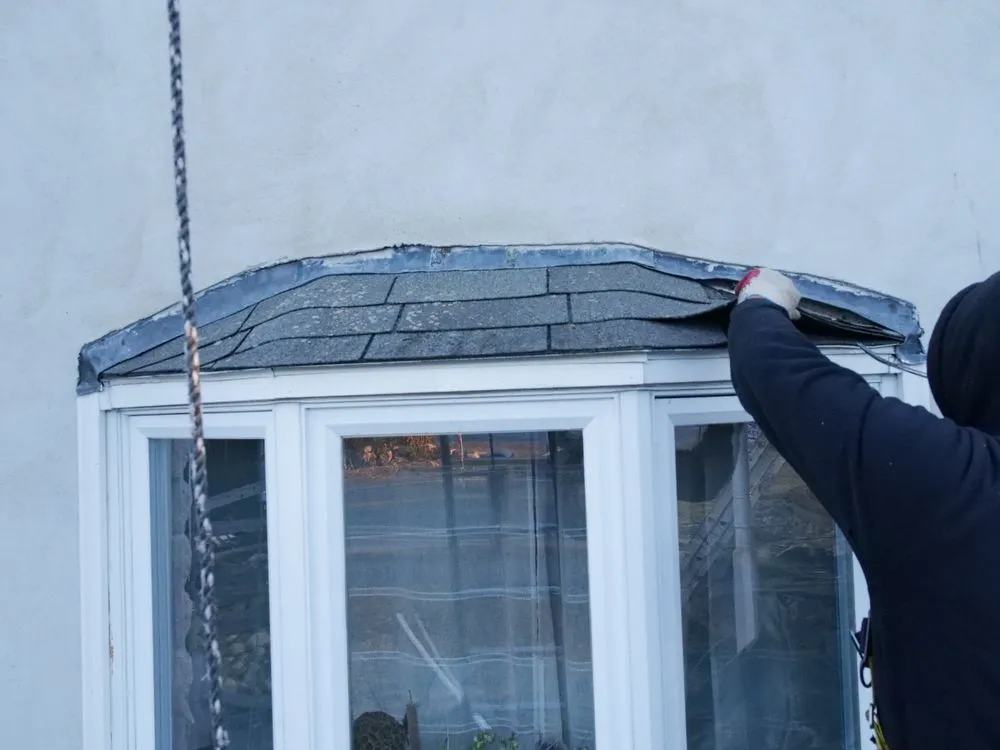 Slide of Manny's Roofing