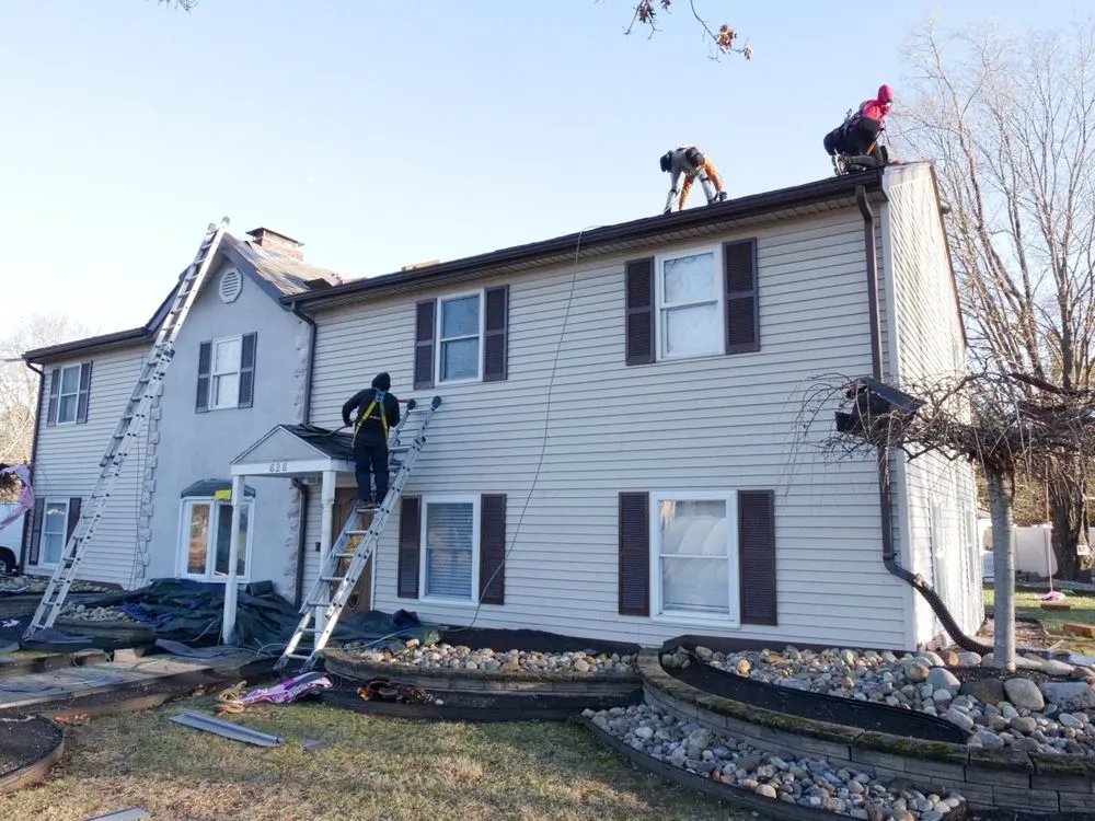 Slide of Manny's Roofing