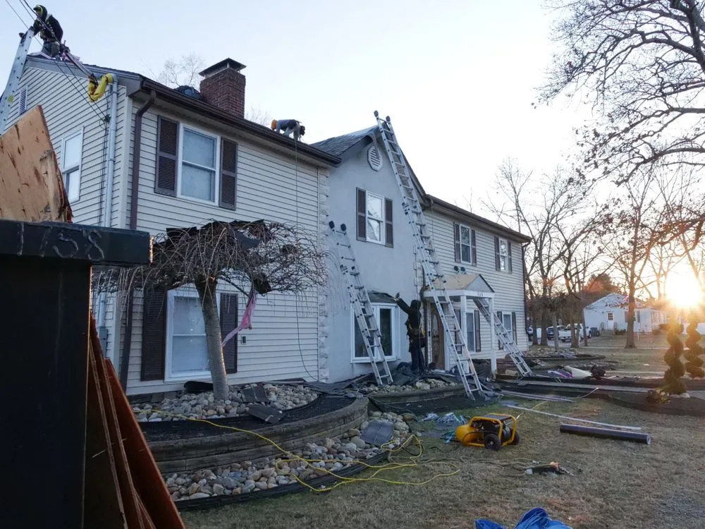 Slide of Manny's Roofing