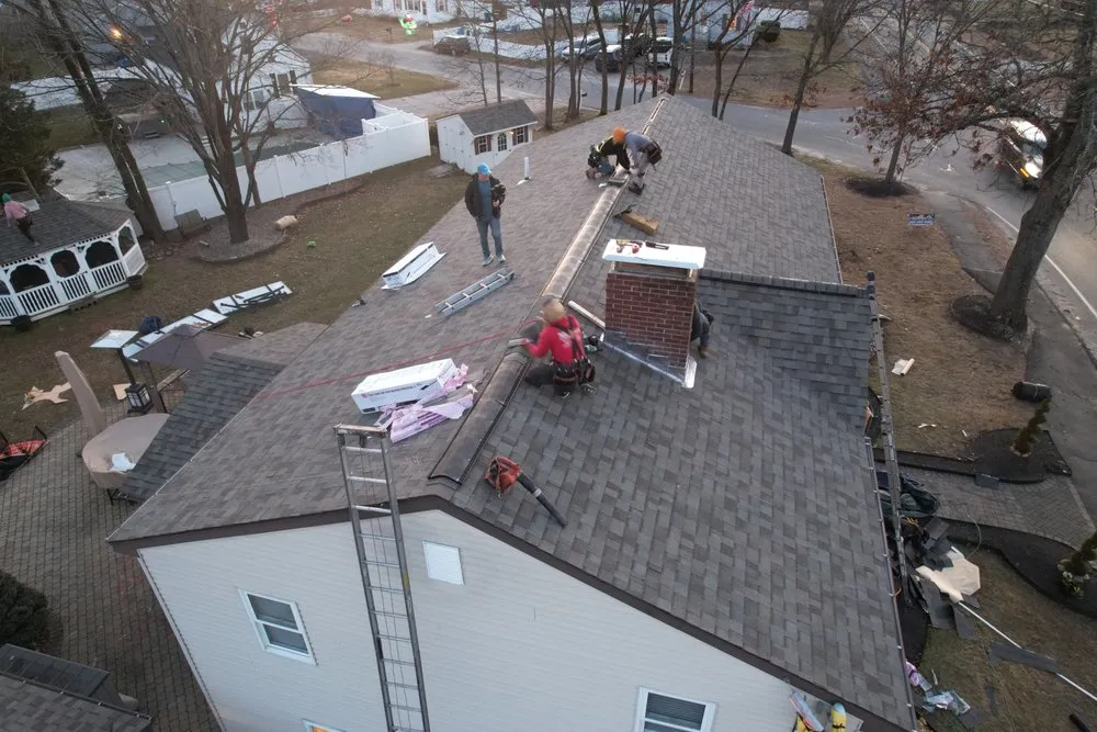 Slide of Manny's Roofing