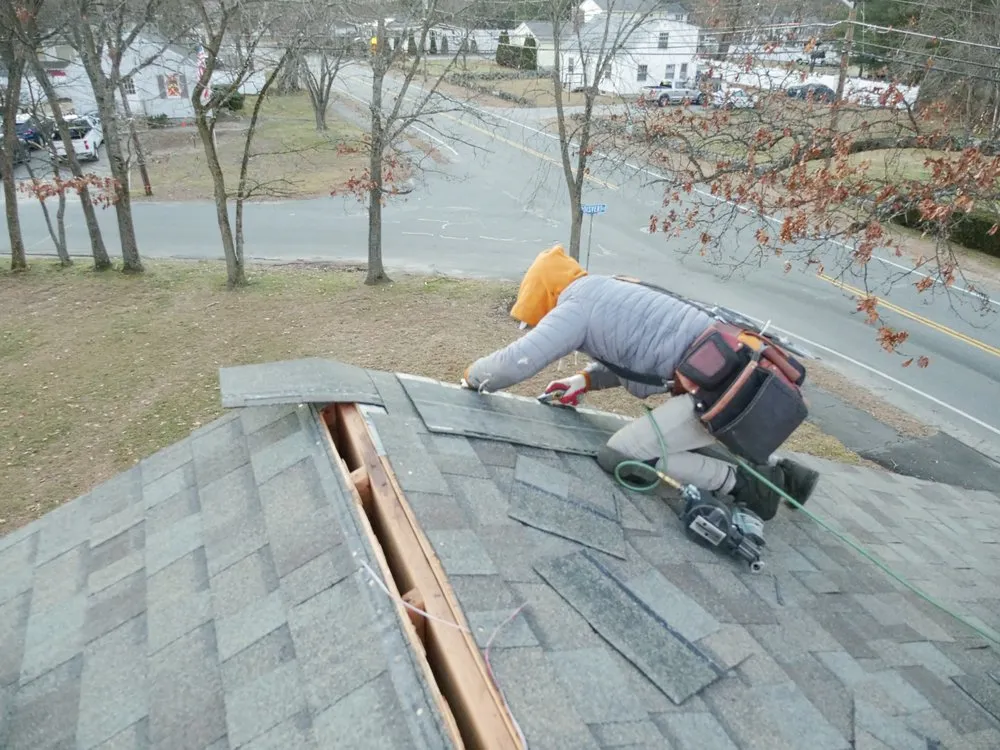 Slide of Manny's Roofing