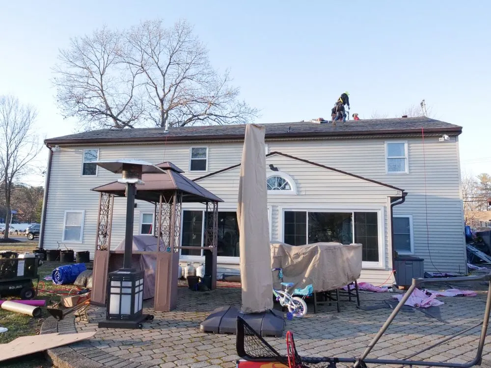 Slide of Manny's Roofing