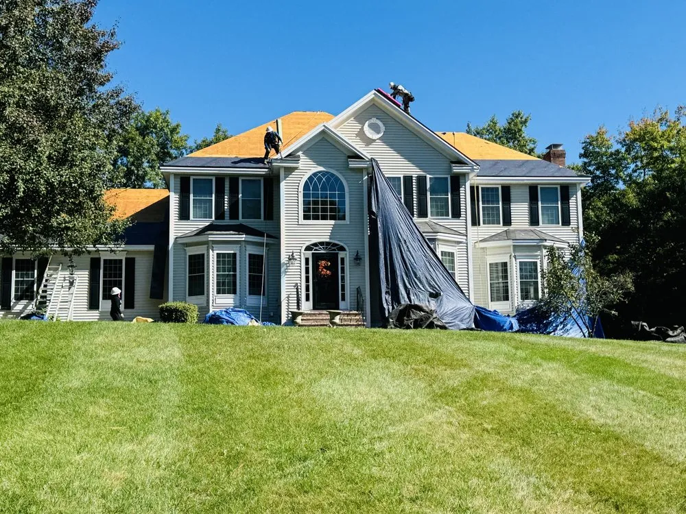 Slide of Manny's Roofing