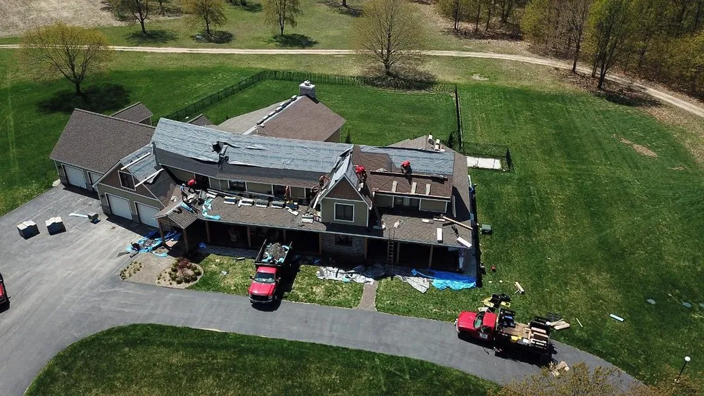 Professional roof leak repair in Williamsburg, MI by Mariage Roofing Company