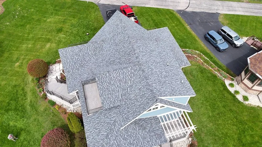Licensed storm damage roof repair with free inspection across Williamsburg, MI - Mariage Roofing Company