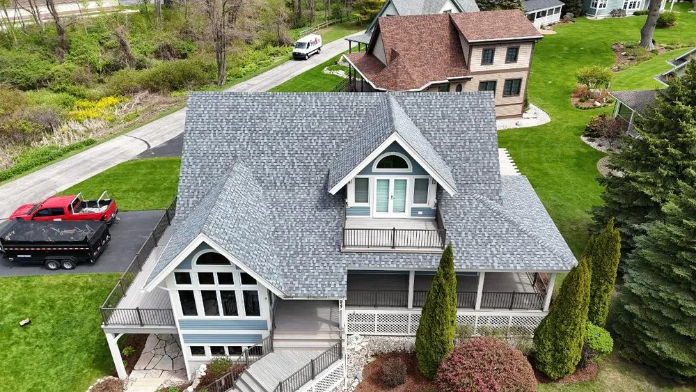 Expert roof repair with free inspection in Williamsburg, MI by Mariage Roofing Company
