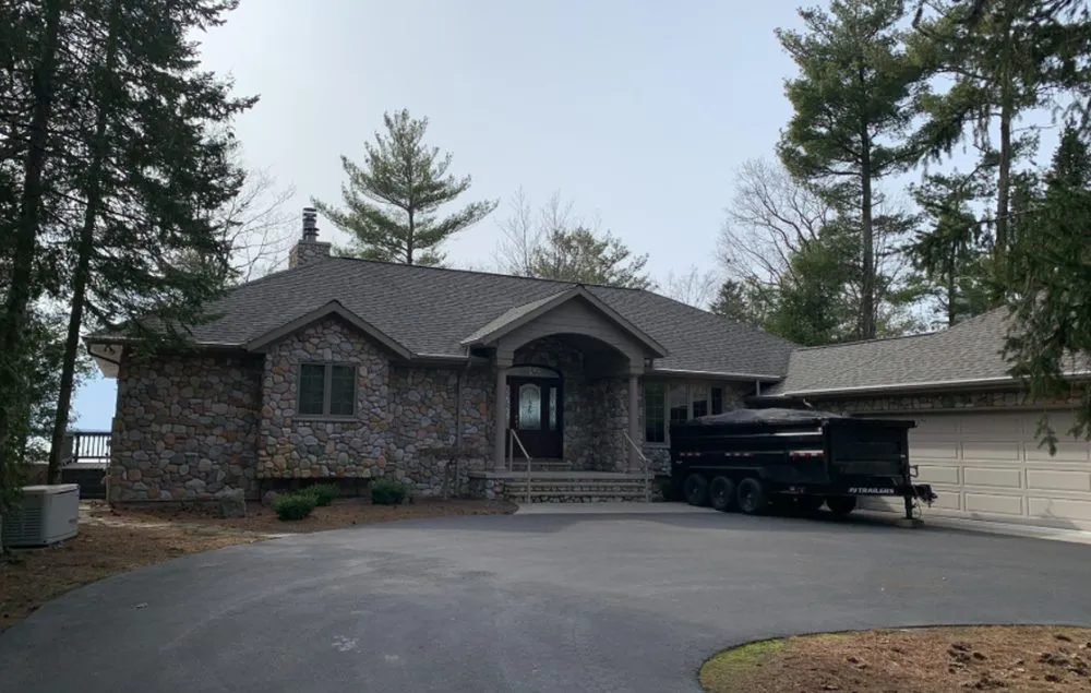 Professional storm damage roof repair for homes across Williamsburg, MI - Mariage Roofing Company