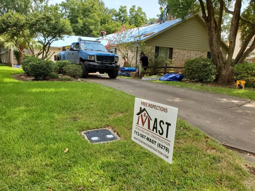 Slide of Mast Roofing & Construction