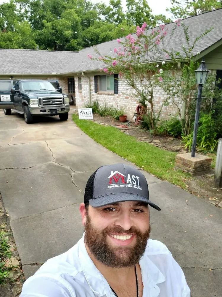 Slide of Mast Roofing & Construction