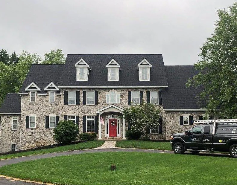 Local roof leak repair after storm damage in Oley, PA by Mast Roofing & Construction
