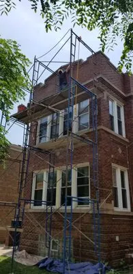 Masters Elite Roofing And Tuckpointing Logo