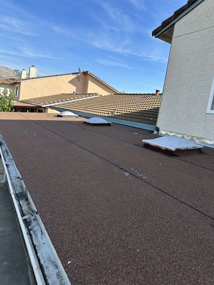 Slide of McGraw and Sons Roofing