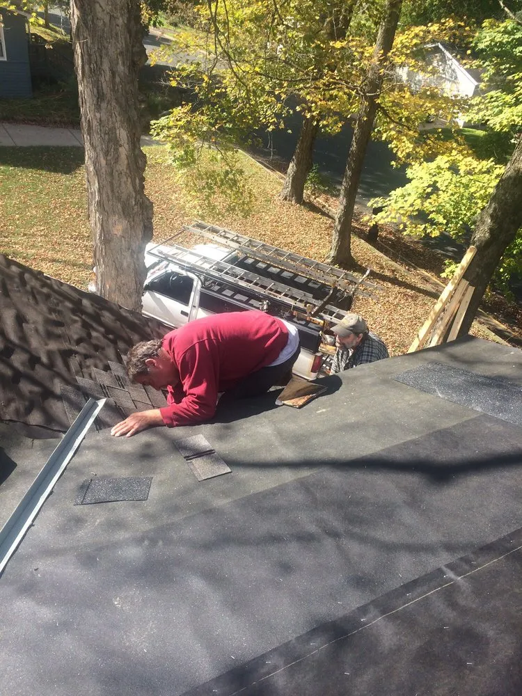 Slide of Mckenzies Roofing