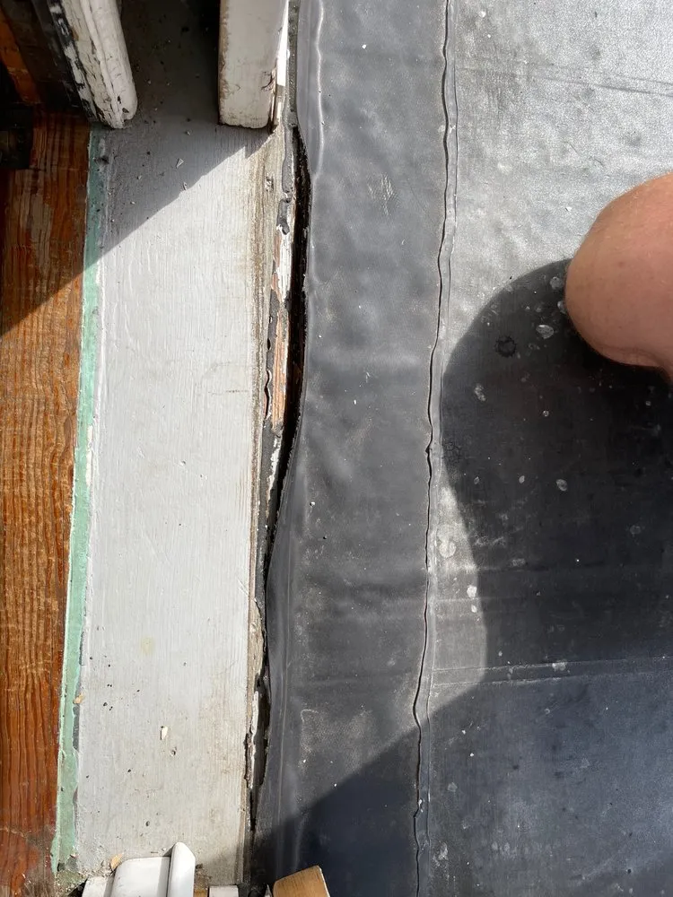 Slide of McPhail Roofing