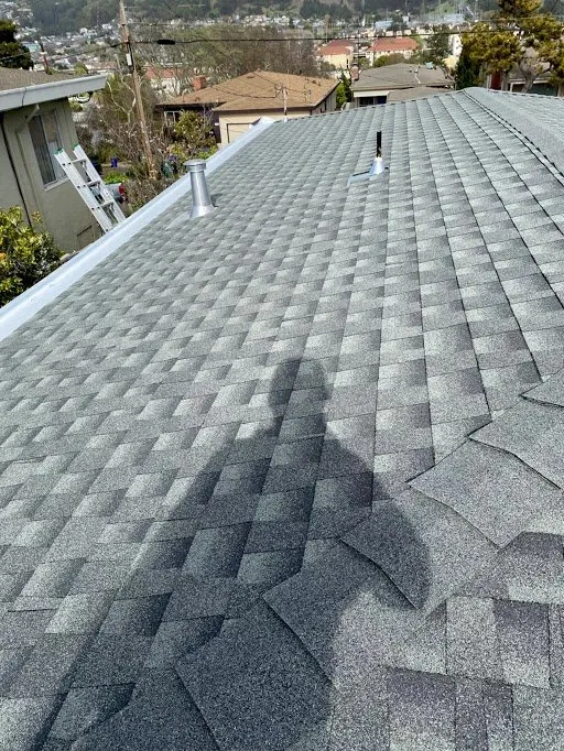 Slide of Mel's Roofing