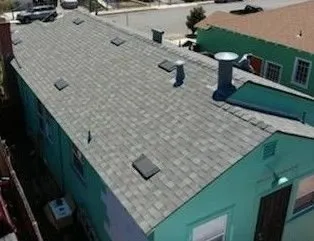 Slide of Mel's Roofing