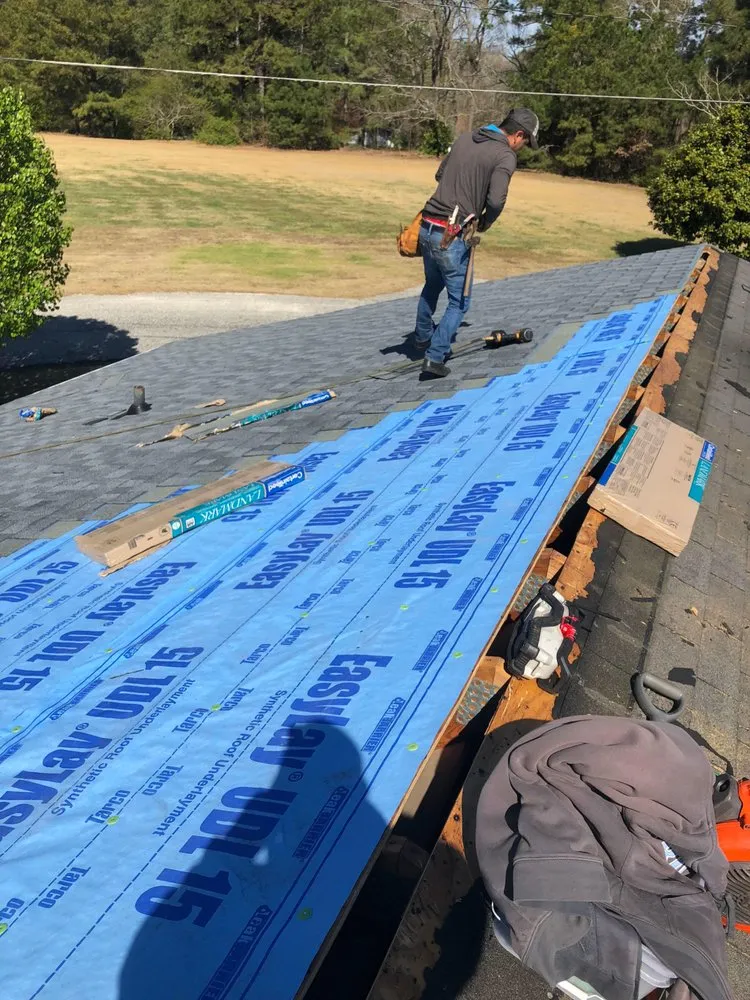 Slide of Melvin's Roofing