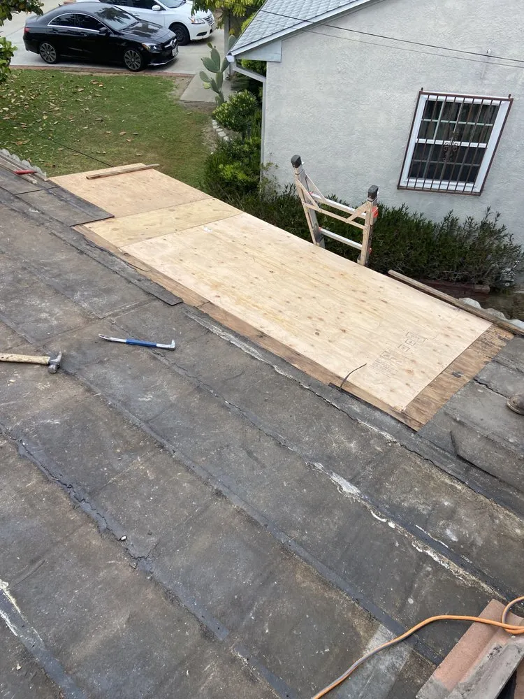 Slide of Mencho's Roofing & Repairs