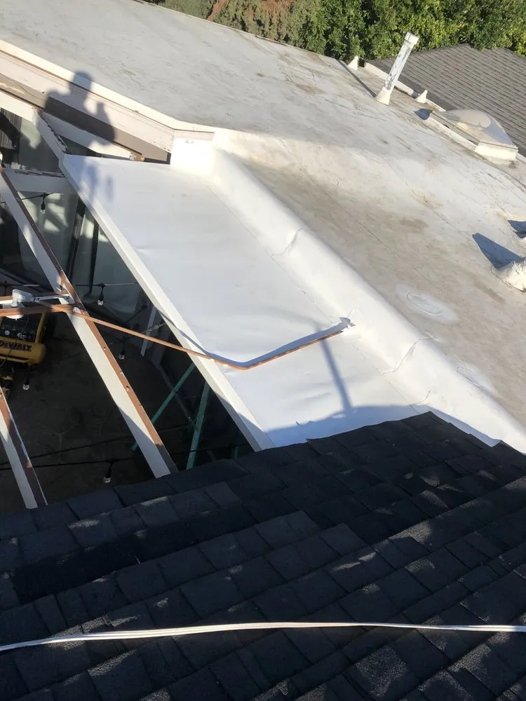 Slide of Mencho's Roofing & Repairs