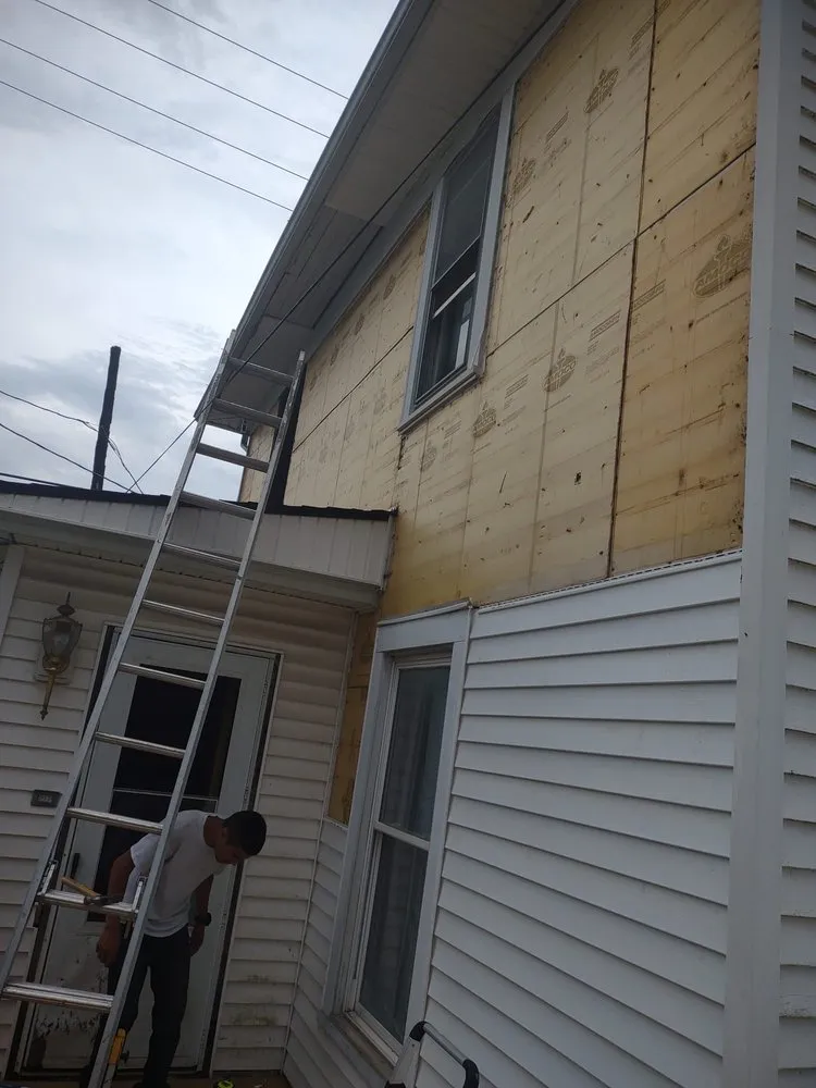 Slide of Menny Roofing