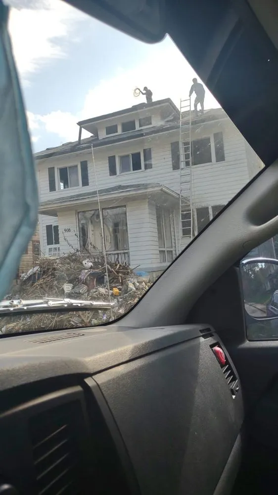 Slide of Menny Roofing