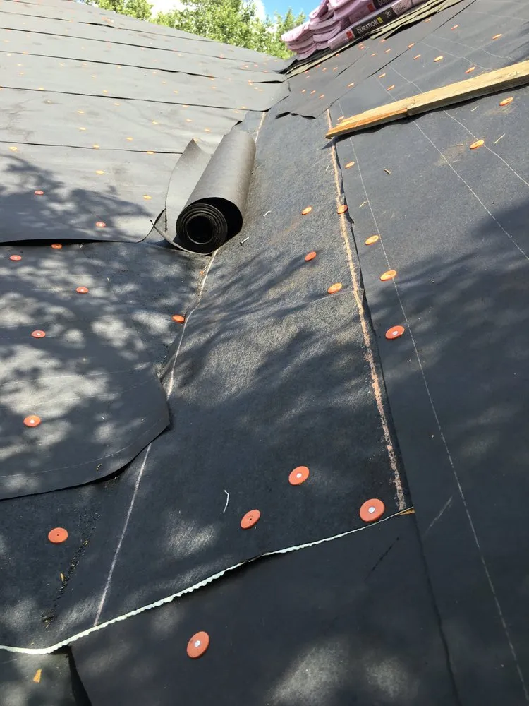 Slide of Mercedes Roofing