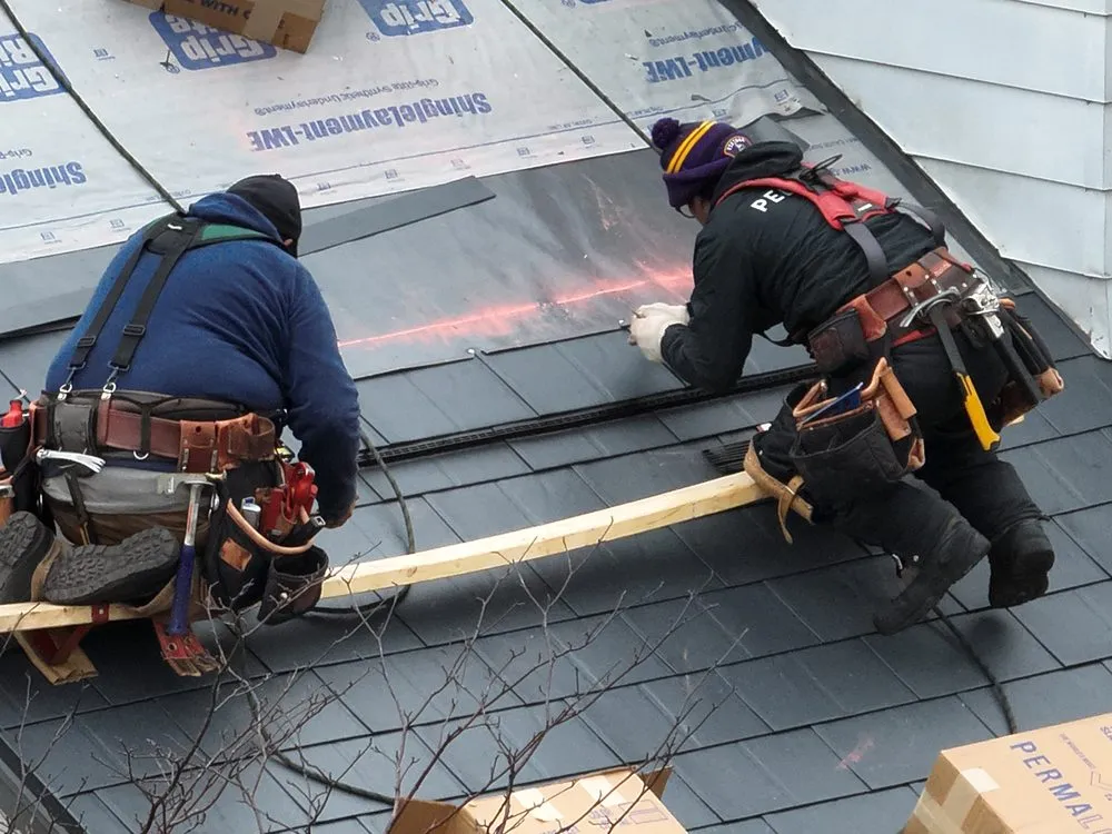 Slide of Metal Roofers
