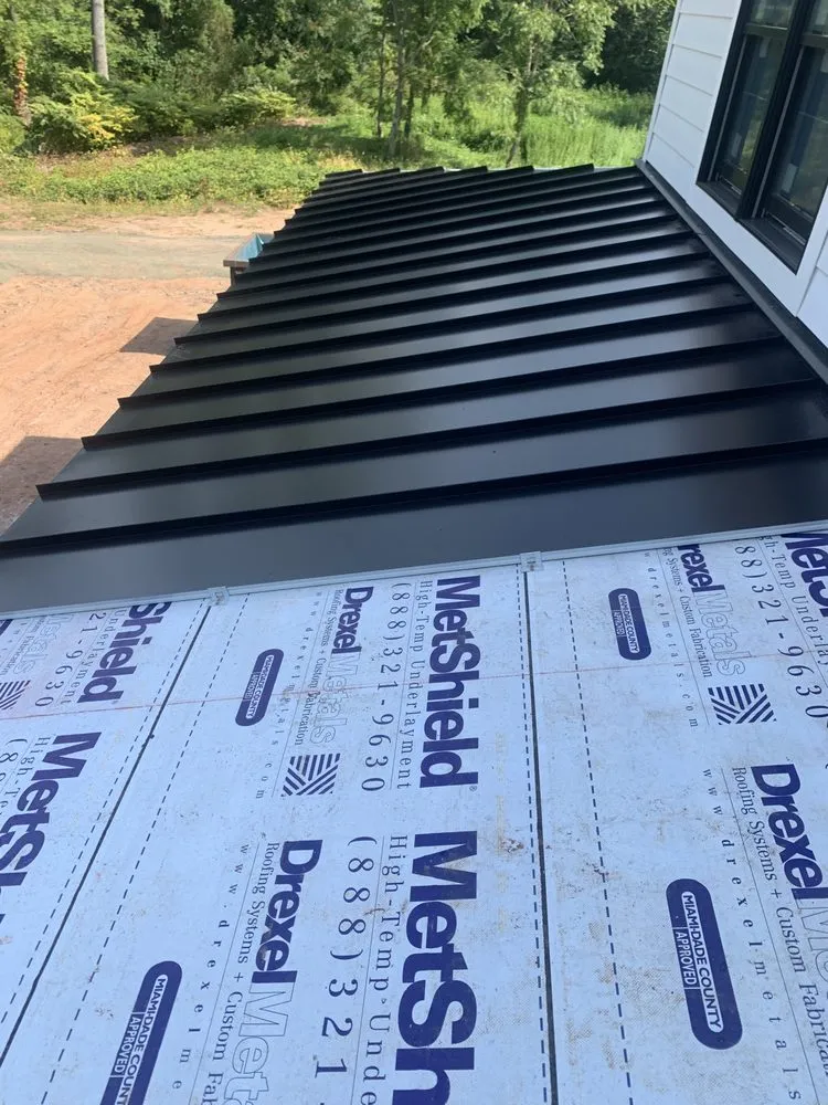 Slide of MGT Roofing Services