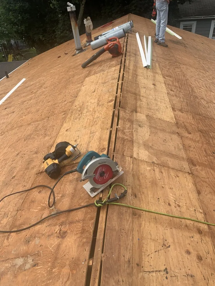 Slide of MGT Roofing Services