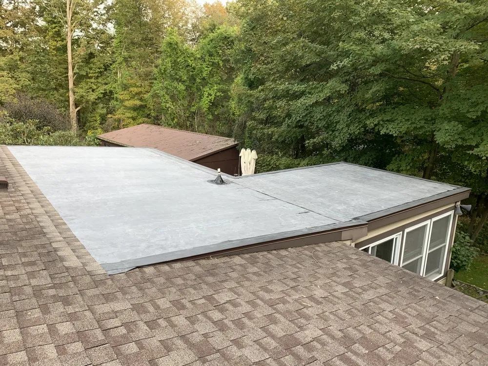 Slide of MGT Roofing Services