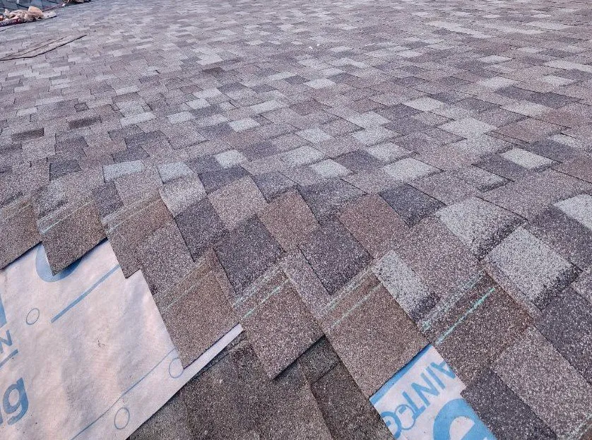 Licensed storm damage roof repair in Beecher City, IL by Mid-State Construction And Roofing
