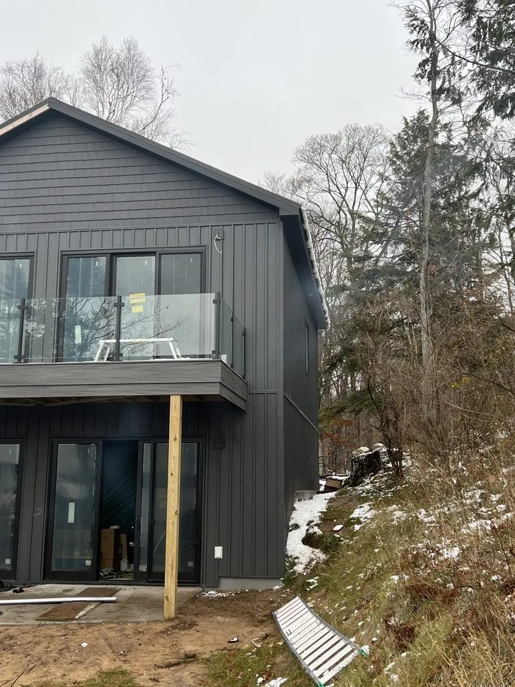 Top-rated roof replacement in Williamsburg, MI by Midwest Exteriors