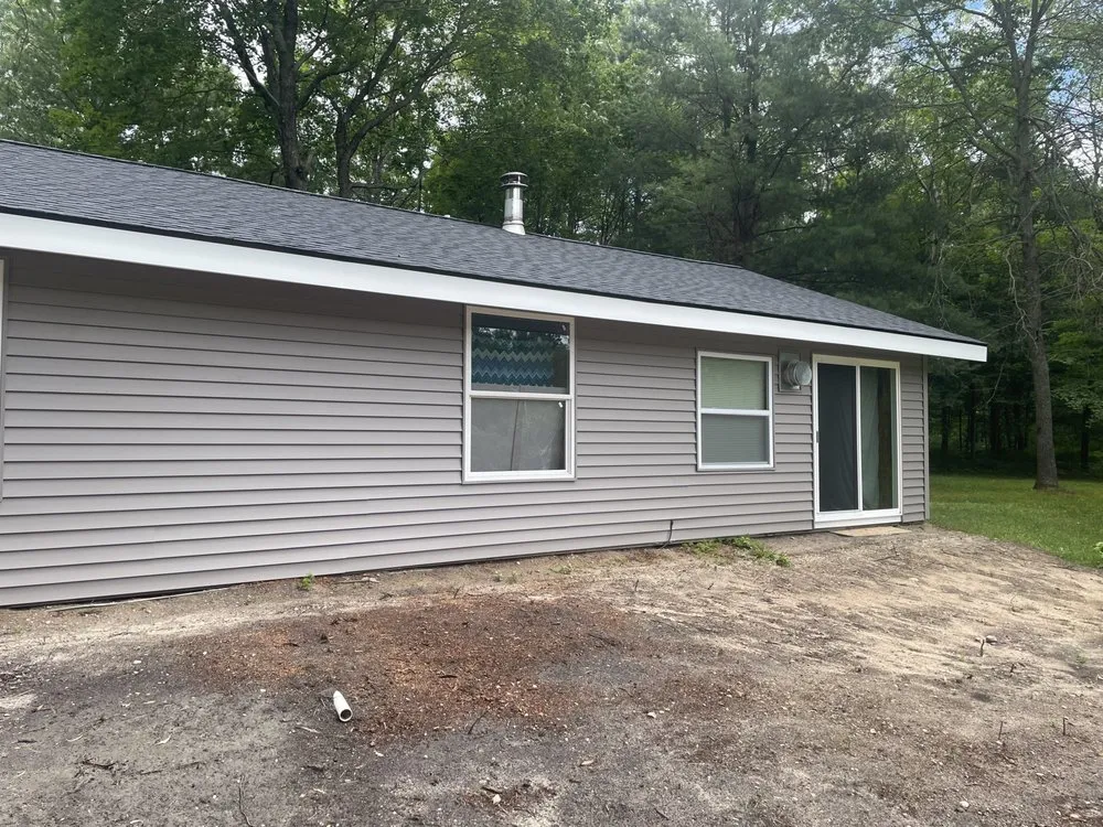 Emergency shingle roofing service in Williamsburg, MI by Midwest Exteriors