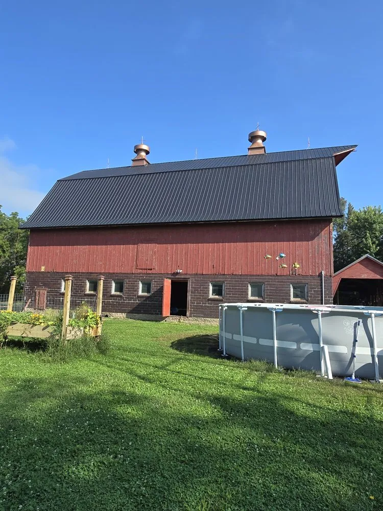 Local storm damage roof repair after storm damage across Good Thunder, MN - Midwestern Construction