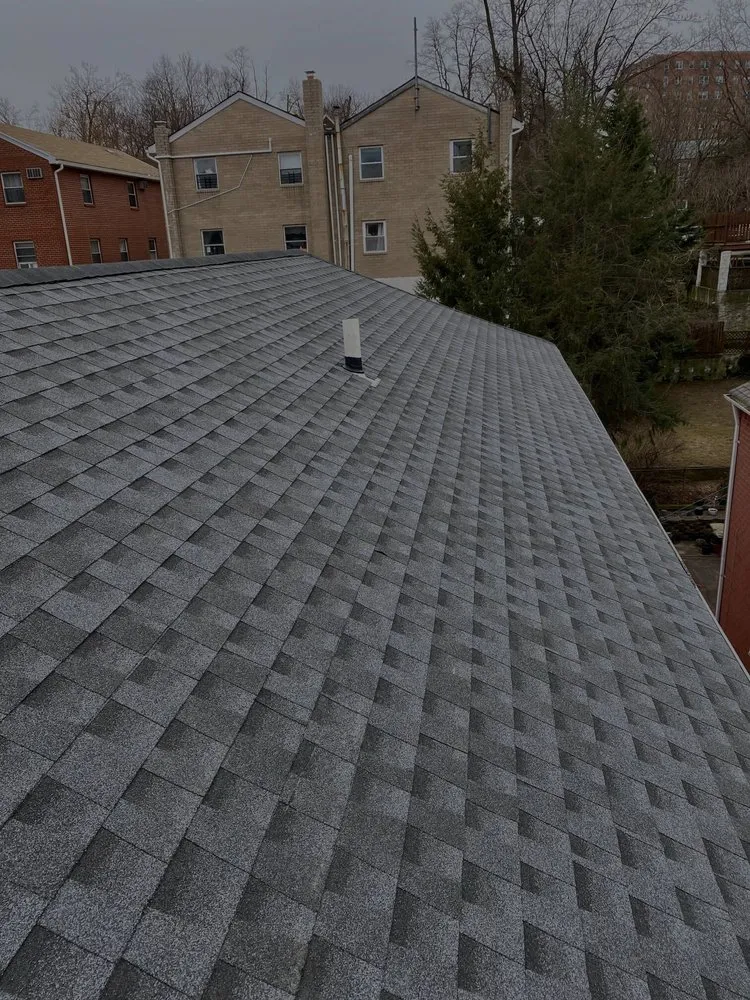 Slide of Mighty Roofing & Siding Contractors