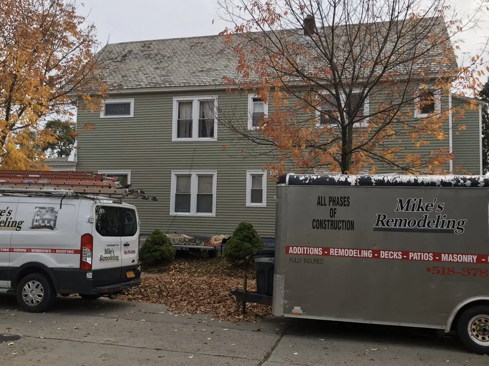 Licensed roof leak repair after storm damage in Rexford, NY by Mikes Remodeling