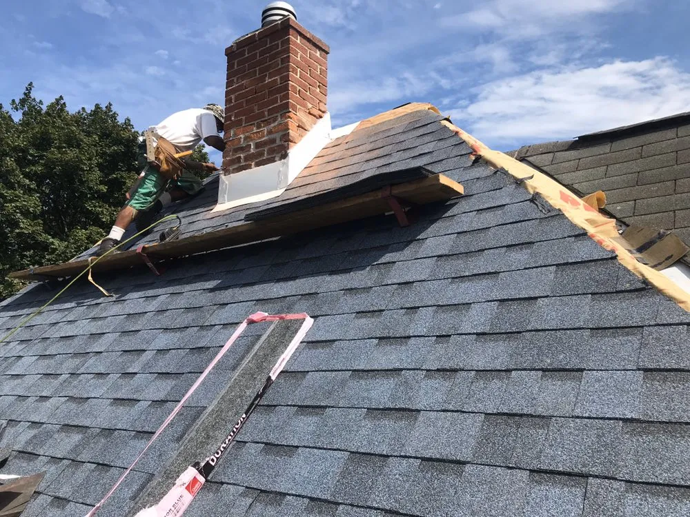 Licensed storm damage roof repair for homes in Rexford, NY by Mikes Remodeling