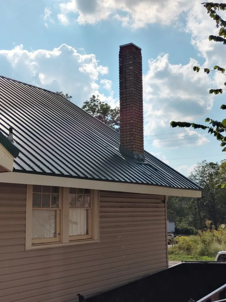 Slide of Mike's roofing and repairs