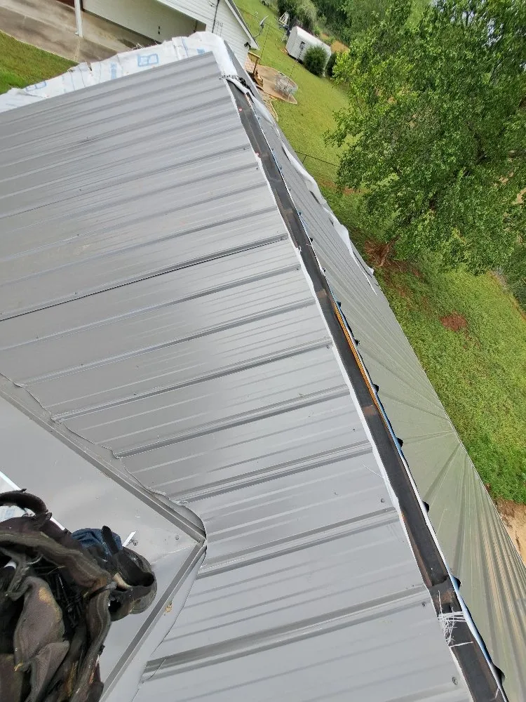 Slide of Mike's roofing and repairs