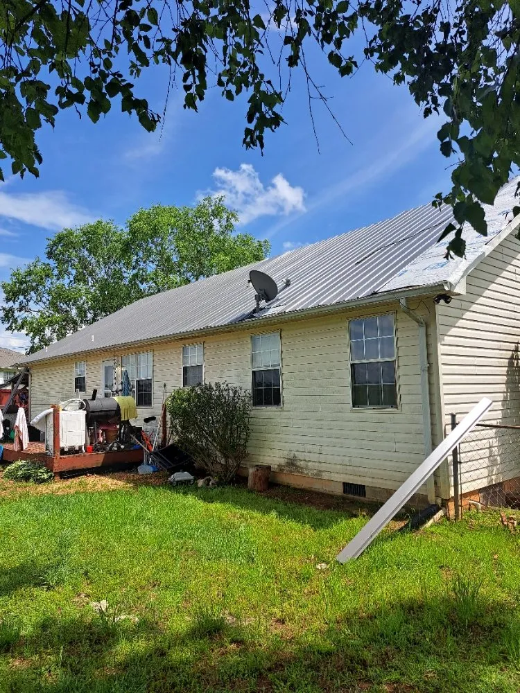 Slide of Mike's roofing and repairs