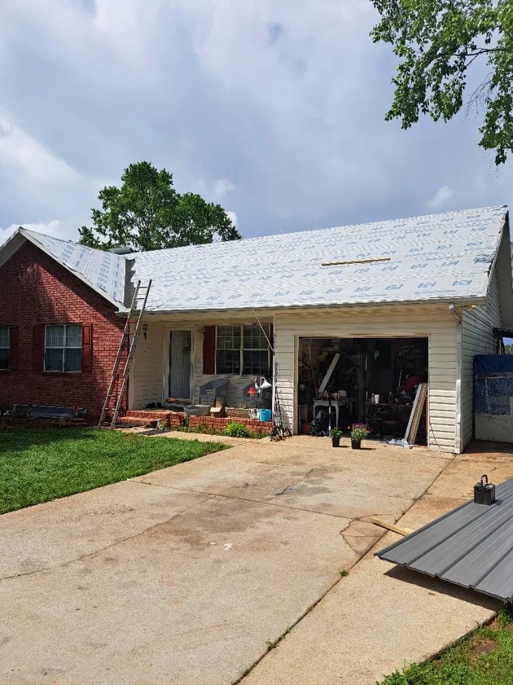 Slide of Mike's roofing and repairs