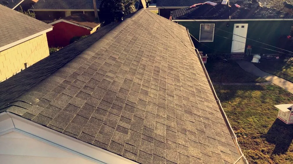 Slide of Mike's Roofing Company