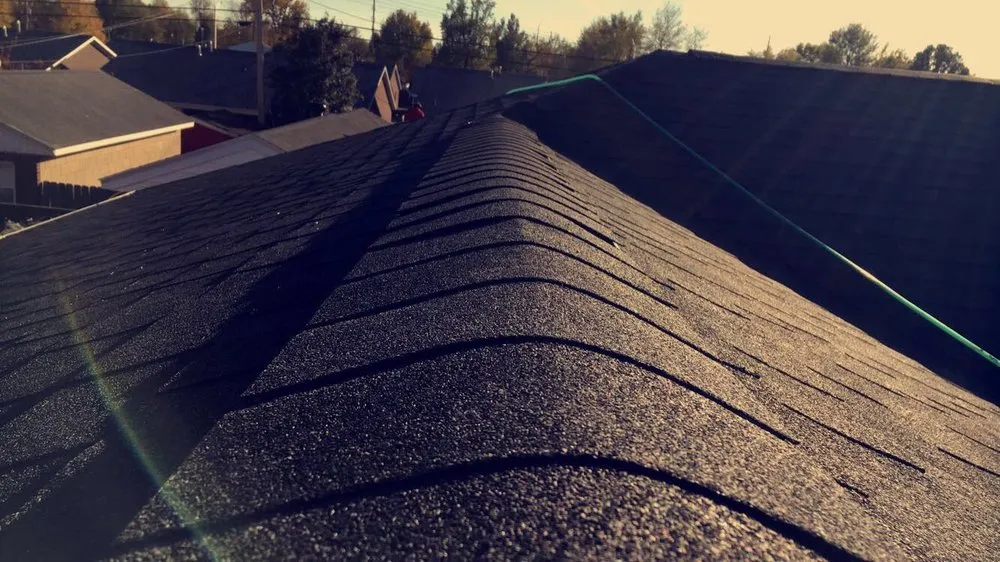 Slide of Mike's Roofing Company