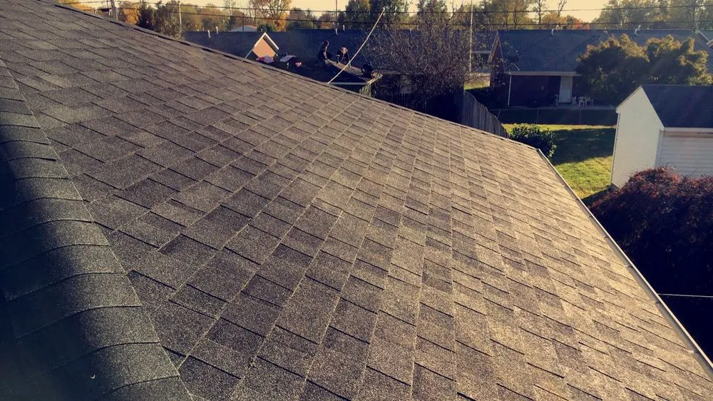 Slide of Mike's Roofing Company